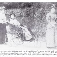 In the bath chair was Rector Rev Shann's wife, and pushing it was Annie Ayres (then Bastin), c.1910. Photograph by J. H. Croft, From the collection of Rose Maling. Used with kind permission from Carolyn Birch. Book has an error, Shann is correct.